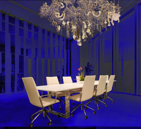 classy chrome base Glass Spartan Table is power and data friendly